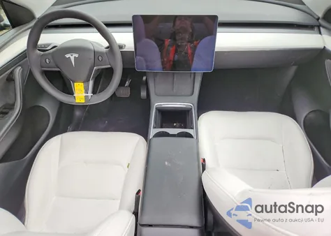 2025 Tesla Model Y from USA, damaged, VIN 7SAYGDED2SF228221